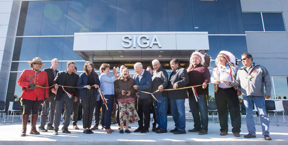 Ribbon cutting at grand opening of SIGA central office